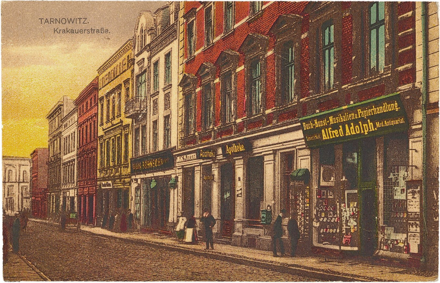 Fragment ul. Krakowskiej. Na pierwszym planie witryna księgarni Alfreda Adolpha, pocztówka pochodząca z lat 1907–1914; wł. Beata i Jacek Kalke Fragment ul. Krakowskiej. Na pierwszym planie witryna księgarni Alfreda Adolpha, pocztówka pochodząca z lat 1907–1914; wł. Beata i Jacek Kalke